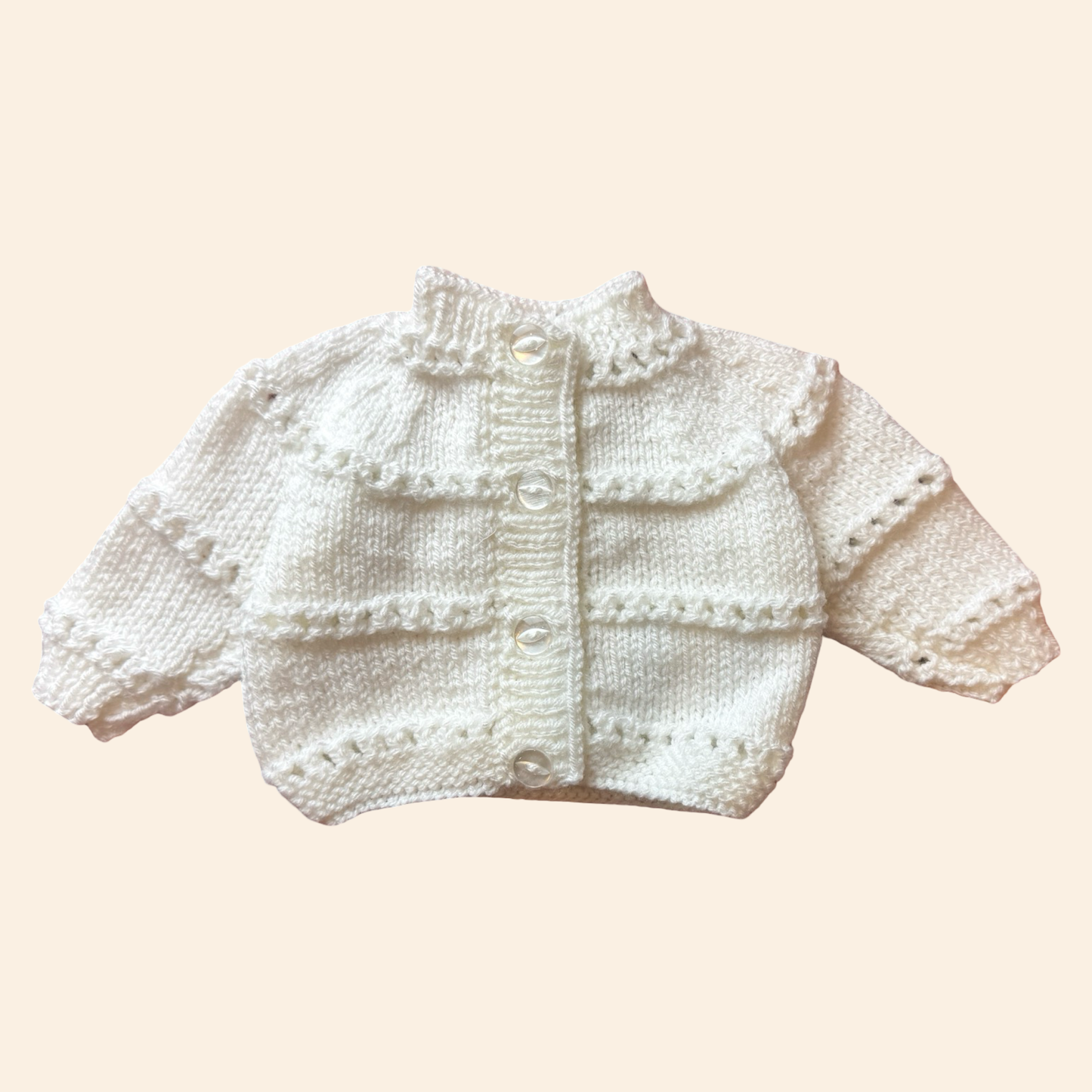 white newborn hand knit cardigan